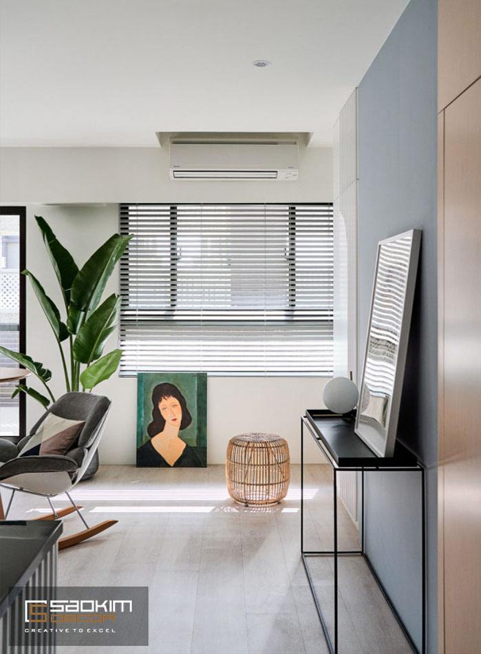 Không gian thư giãn nhỏ cho các thành vieenc trong căn hộ tận dụng khoảng trống của bếp và phòng khách